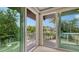 Water view from the bedroom balcony showcasing the lush tropical surroundings at 940 Siesta Key Pl, Sarasota, FL 34242