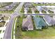 Aerial view of the home showcasing its proximity to a quiet residential street and well-manicured lawn at 12343 Halfmoon Lake Ter, Bradenton, FL 34211