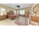 Spacious bedroom with a ceiling fan, plush rug, and windows providing natural light at 12343 Halfmoon Lake Ter, Bradenton, FL 34211