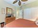 The bedroom features a ceiling fan, neutral walls, and a closet at 12343 Halfmoon Lake Ter, Bradenton, FL 34211