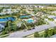 Aerial view of the community amenities, including the pool, tennis courts, and playground at 12343 Halfmoon Lake Ter, Bradenton, FL 34211