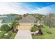 Inviting single Gathering home with a two car garage, beautiful landscaping and manicured lawn at 12343 Halfmoon Lake Ter, Bradenton, FL 34211