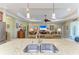 Open kitchen with stainless steel sink and appliances, flowing into the living room at 12343 Halfmoon Lake Ter, Bradenton, FL 34211