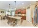 Bright kitchen with a large island, granite countertops, and stainless steel appliances at 12343 Halfmoon Lake Ter, Bradenton, FL 34211