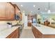 Well-equipped kitchen featuring stainless steel oven and range and granite countertops at 12343 Halfmoon Lake Ter, Bradenton, FL 34211