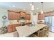 Kitchen featuring granite countertops, stainless steel appliances, island seating, and ample counter space at 12343 Halfmoon Lake Ter, Bradenton, FL 34211