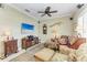 Cozy living room with a ceiling fan, mounted speakers and a wall-mounted television at 12343 Halfmoon Lake Ter, Bradenton, FL 34211