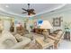 Relaxing living room with comfortable seating, stylish décor, and lots of natural light at 12343 Halfmoon Lake Ter, Bradenton, FL 34211