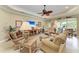Comfortable living room showcasing cozy seating, stylish décor, and a sliding glass door at 12343 Halfmoon Lake Ter, Bradenton, FL 34211