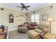Well decorated living room with ceiling fan, wall art and comfortable seating at 12343 Halfmoon Lake Ter, Bradenton, FL 34211
