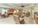 Open living space with a view of the kitchen and dining room, perfect for entertaining guests at 12343 Halfmoon Lake Ter, Bradenton, FL 34211