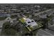 An aerial view of the house in the community and screened pool at 1239 Pinebrook Way, Venice, FL 34285
