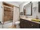 Cozy bathroom with a shower and tub combination, vanity with sink, and ample lighting at 1239 Pinebrook Way, Venice, FL 34285