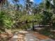 Concrete boat ramp leading to a tranquil waterway, perfect for launching kayaks and enjoying nature at 1239 Pinebrook Way, Venice, FL 34285