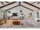 Spacious living room with vaulted ceilings, exposed beams, and contemporary decor at 1239 Pinebrook Way, Venice, FL 34285