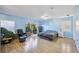 Large bedroom with light blue walls, wood floors and a sliding glass door at 1308 3Rd Street E Cir, Palmetto, FL 34221