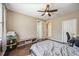 Comfortable bedroom with ceiling fan, dark wood floor, and two closets at 1308 3Rd Street E Cir, Palmetto, FL 34221