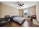 Bedroom with desk and chair features wood laminate flooring, window, and ceiling fan at 1308 3Rd Street E Cir, Palmetto, FL 34221