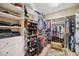 Large walk-in closet with custom shelving and storage solutions for organization at 1308 3Rd Street E Cir, Palmetto, FL 34221