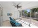 Relaxing screened lanai offers views of a beautifully landscaped backyard with a tranquil waterfall feature at 1565 Saturn Rd, Venice, FL 34293