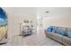 Bright living room featuring tile floors, neutral paint, and comfortable seating for Gathering and guests at 1565 Saturn Rd, Venice, FL 34293