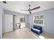 Cozy room with a futon and a view of a screened in porch and outdoor space with lots of windows at 1565 Saturn Rd, Venice, FL 34293