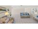 Spacious living room with tile floors, neutral paint, and large windows providing ample natural light at 1565 Saturn Rd, Venice, FL 34293