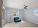 Room featuring a futon and a sliding glass door that allows access to an outdoor space at 1565 Saturn Rd, Venice, FL 34293
