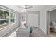 Office featuring a ceiling fan and large windows overlooking the backyard at 1565 Saturn Rd, Venice, FL 34293