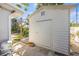 Exterior view of shed, showing its proximity to pond and house at 1565 Saturn Rd, Venice, FL 34293
