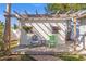 Charming shed with a pergola and cozy outdoor seating area at 1565 Saturn Rd, Venice, FL 34293