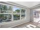 Sun room with a big window that overlooks a beautiful garden view at 1565 Saturn Rd, Venice, FL 34293