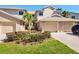 Inviting two-story townhome with a two-car garage and well manicured landscaping at 1718 Starling Dr # 104, Sarasota, FL 34231