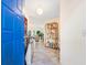 Bright foyer featuring tile flooring and decor, leading into a spacious living area at 1718 Starling Dr # 104, Sarasota, FL 34231