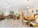 Inviting living and dining area with tile flooring, open layout, and comfortable furniture at 1718 Starling Dr # 104, Sarasota, FL 34231
