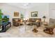 Cozy living room with tile flooring, comfortable seating, and a bright window view at 1718 Starling Dr # 104, Sarasota, FL 34231