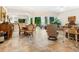 Open-plan living and dining area with tile flooring, natural light, and comfortable furniture at 1718 Starling Dr # 104, Sarasota, FL 34231