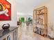 Open-concept living space with tile flooring, decorative shelving and a view of the backyard at 1718 Starling Dr # 104, Sarasota, FL 34231