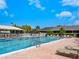 Large community pool with lounge chairs and a spacious deck area to enjoy the sun at 1718 Starling Dr # 104, Sarasota, FL 34231