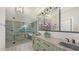 Stunning bathroom with a double vanity, modern lighting, and sleek shower and tub at 1725 Riviera Cir, Sarasota, FL 34232