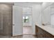 Bathroom featuring double sink vanity with quartz countertop next to glass enclosed shower at 18821 Dayspring Pl, Venice, FL 34293