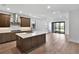 Modern kitchen with stainless steel appliances and a center island facing the living area at 18821 Dayspring Pl, Venice, FL 34293