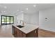 Kitchen island featuring a sink and lots of open space at 18821 Dayspring Pl, Venice, FL 34293