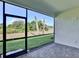 Screened patio with beautiful pavers and an expansive view of the lush backyard at 18821 Dayspring Pl, Venice, FL 34293