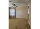 Bedroom with a ceiling fan, carpeted floors, and window with curtains at 197 Palm Harbor Dr, North Port, FL 34287