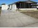 Charming single-story home featuring a screened porch and convenient driveway at 197 Palm Harbor Dr, North Port, FL 34287