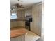 Bright kitchen featuring ample counter space, modern appliances, and a view to the dining area at 197 Palm Harbor Dr, North Port, FL 34287