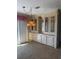 Bright living area featuring built in cabinets and a large window with ample natural light at 197 Palm Harbor Dr, North Port, FL 34287