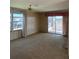 Open living room with large windows and a sliding glass door, bright and airy space at 197 Palm Harbor Dr, North Port, FL 34287