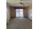 Spacious living room filled with natural light and sliding glass doors to screened porch at 197 Palm Harbor Dr, North Port, FL 34287
